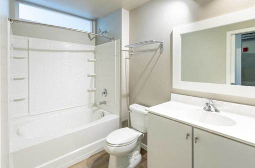 a bathroom with a shower toilet and a sink at Ann Arbor City Club, Ann Arbor