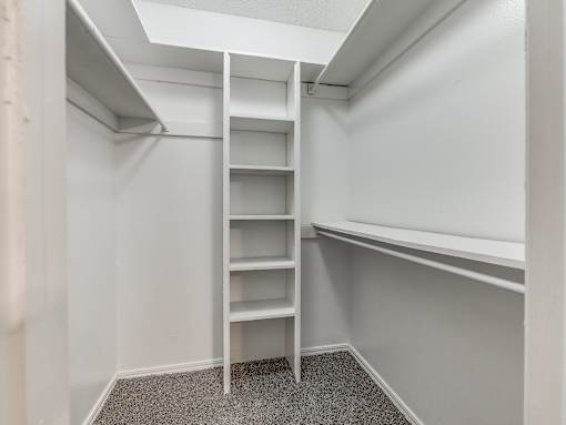 A white ladder in a small, empty room.
