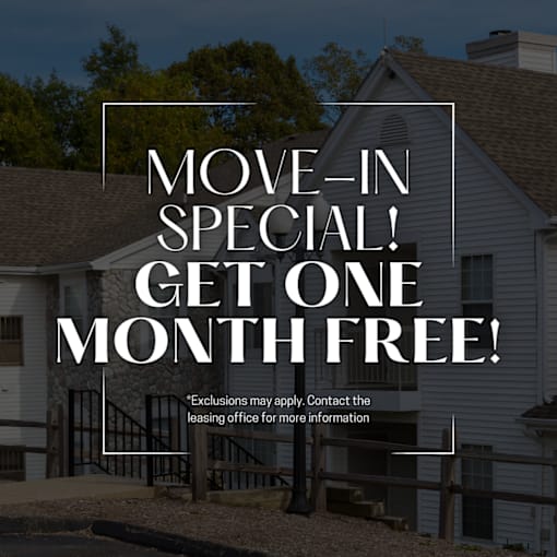 A house with a sign offering a free month for a move-in special.