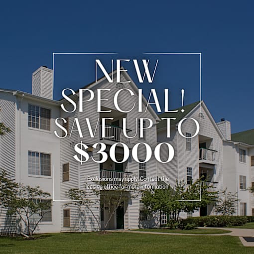 A large white building with a sign that says "NEW SPECIAL! SAVE UP TO $3000".