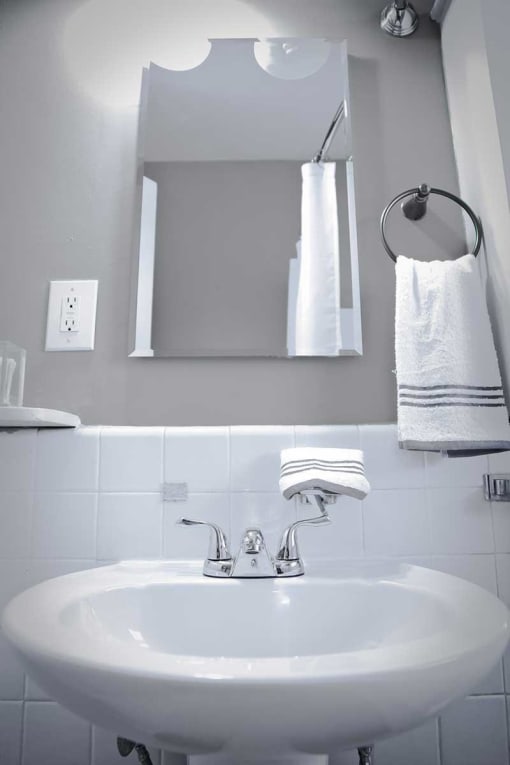 Modern bathroom with pedestal sink.