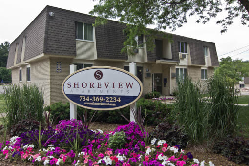 Shoreview Apartments Exterior monument sign with purple flowers