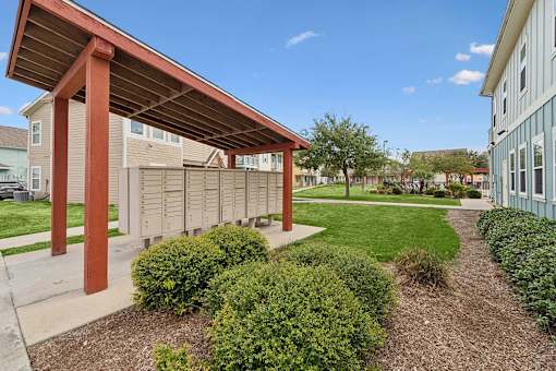 A building with a red roof and a covered walkway.
