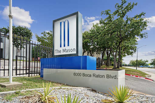 The Mason sign is blue and white with a large M on it.