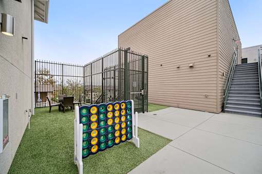 A large outdoor Connect Four game set up on a lawn.