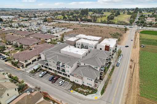 A large building with a parking lot in front of it.