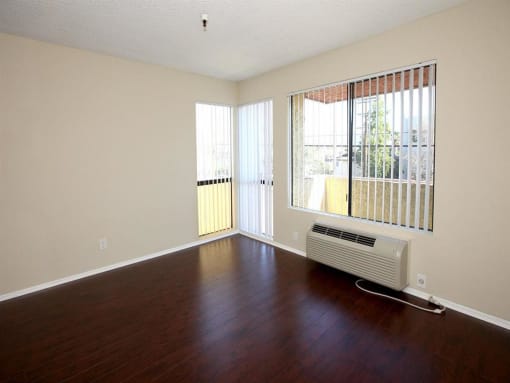 Living room with hardwood floors and AC