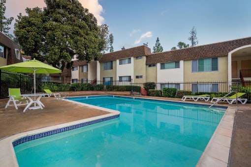 our apartments offer a swimming pool with chairs and umbrellas