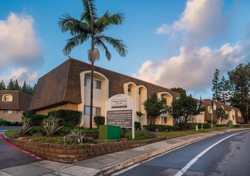 a building with a palm tree in front of it