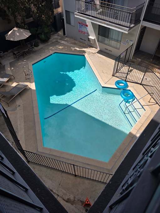 A small pool with a blue tinted water.