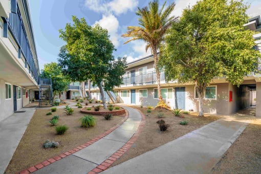 courtyard with trees and plants at the residences at silver hill in suitland, md