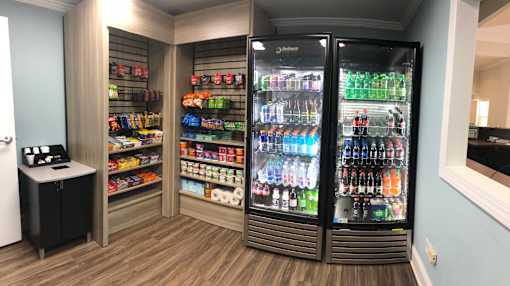 A vending machine with a variety of drinks and snacks.