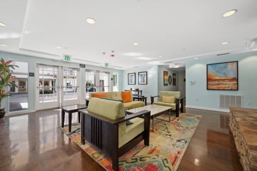 a living room filled with furniture and a large rug
