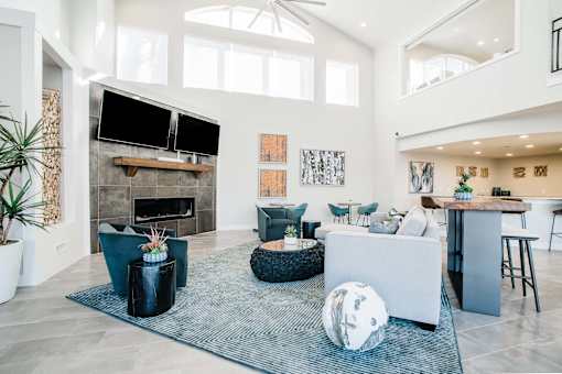 Clubroom with seating area, fireplace, and TV at Bridgwater, Colorado, 80111
