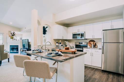 Dining area and kitchen with stainless steel appliances at Bridgwater, Greenwood Village, 80111