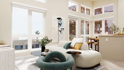 A living room with a white couch and a green chair at Skyview Sunset Apartments, Los Angeles