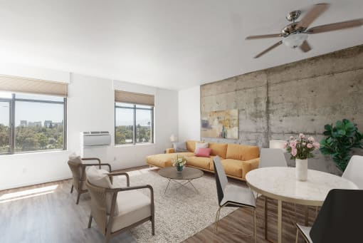 Living room with concrete accent wall at Vendome Place, San Jose, CA