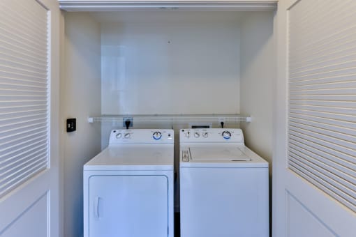 laundry closet with washer and dryer at Capriana at Chino Hills, California