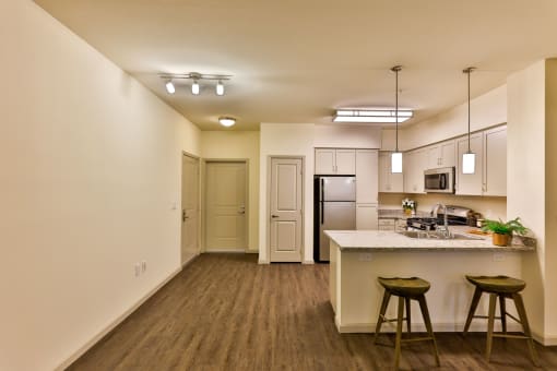 furnished kitchen with grey cabinets at Capriana at Chino Hills, California