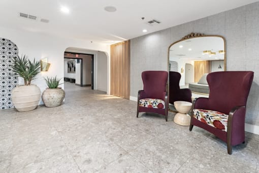 clubroom chairs with large mirror behind at Vera Cortez Hill, California, 92101