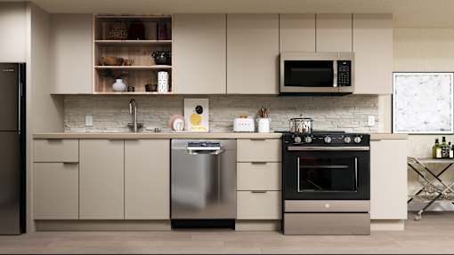 A modern kitchen with a stainless steel dishwasher and oven at Skyview Sunset Apartments, Los Angeles, California