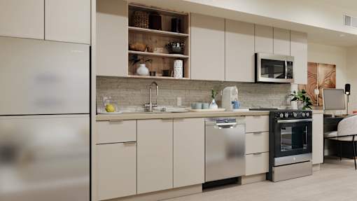 A modern kitchen with stainless steel appliances and white cabinets at Skyview Sunset Apartments, Los Angeles