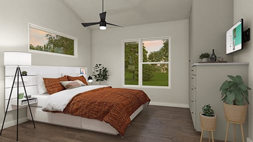 a bedroom with a bed and a ceiling fan