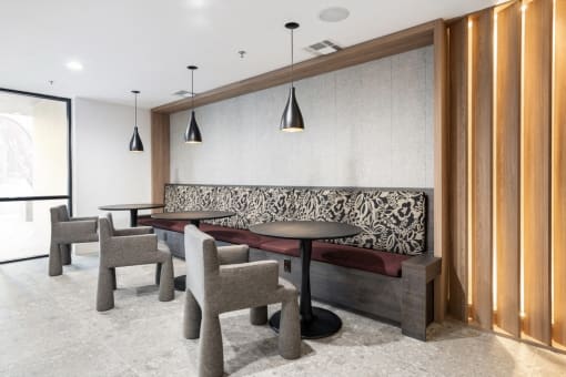 Clubroom with seating and tables at Vera Cortez Hill, San Diego
