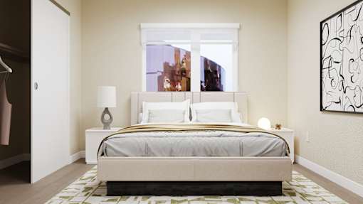 A bedroom with a large bed and a painting on the wall at Skyview Sunset Apartments, Los Angeles, CA