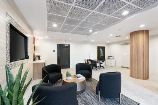 clubroom with chairs and a tv and a table at Vera Cortez Hill, California, 92101