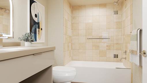 A bathroom with a toilet, sink, and a painting on the wall at Skyview Sunset Apartments, Los Angeles 90046