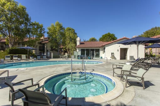 Outdoor pool and jacuzzi area with seating at Pointe Niguel, Laguna Niguel, California