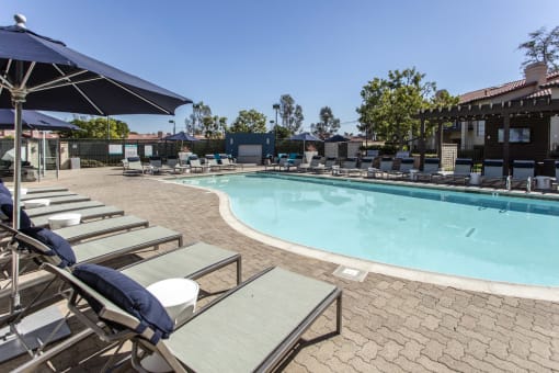 Outdoor pool with lounge chairs at Pointe Niguel, California