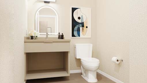 A bathroom with a toilet, sink, and a painting on the wall at Skyview Sunset Apartments, Los Angeles, CA