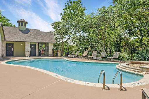 A pool with lounge seating
