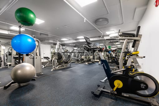 a gym with weights and other exercise equipment in a building