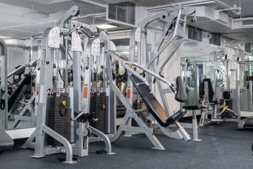 a variety of weight machines in a gym