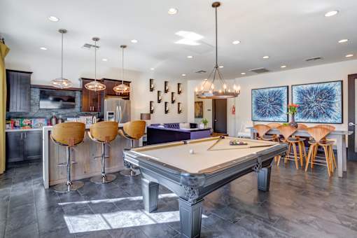 Apartments For Rent in 89147 Spring Valley NV - Alicante - Clubroom Featuring Pool Table, Kitchen, Modern Lighting, Bar Stools and Tables
