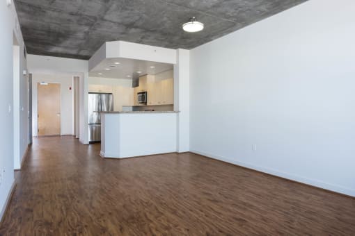 Oakland CA Apartments for Rent - Aqua Via - Spacious Unfurnished Living Room with Wood-Style Flooring at Aqua Via Apartment, California