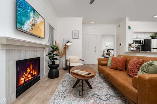 A living room with a fireplace and a couch.