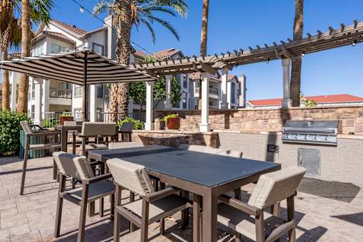 A table with chairs is set up outside.