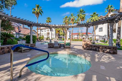 A pool with a blue metal railing.
