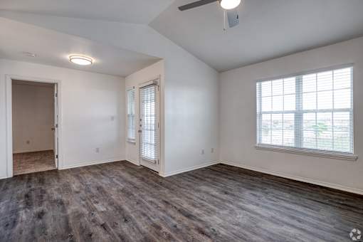 A room with a window and a door.