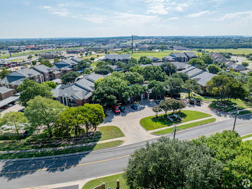 A residential area with houses and trees.