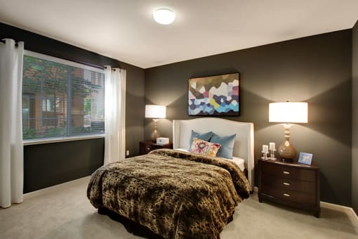 Two-Bedroom Apartments in San Jose, CA- Aviara- Wall-to-Wall Carpeting, Dark Colored Walls, Large Window, and Identical Nightstands