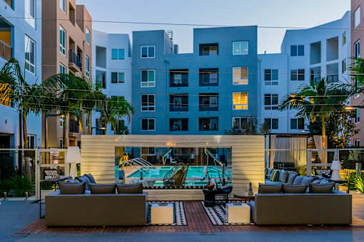 A modern building with a pool in the courtyard. at Baker Block, Costa Mesa, CA