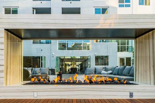 A modern house with a fire pit in the front yard. at Baker Block, California