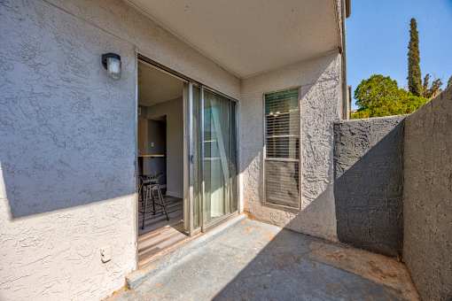 A patio area with a glass door