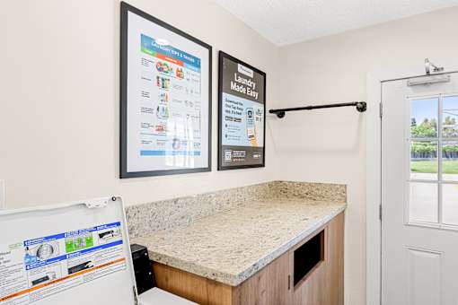 A laundry room with a washer and dryer.