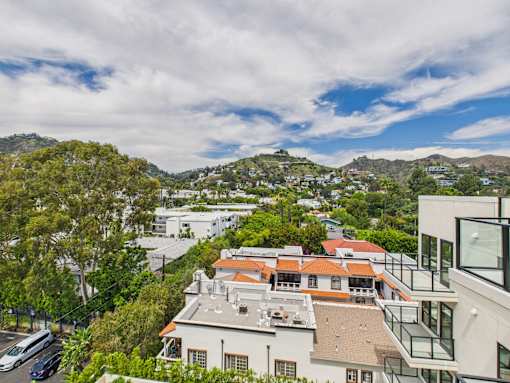 A view of a residential area with houses and trees at Skyview Sunset Apartments, Los Angeles, CA